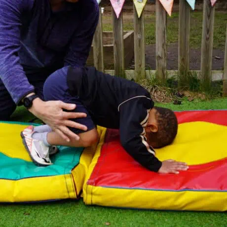 Nursery child learning to roll