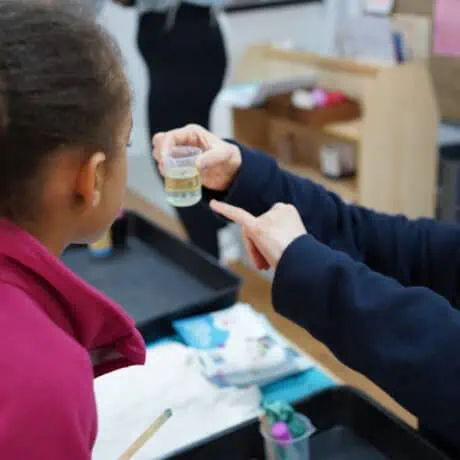 Nursery child taking part in science experiment