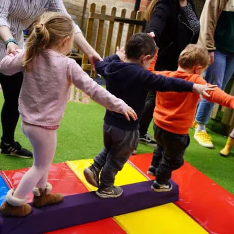 Nursery children learning to balance